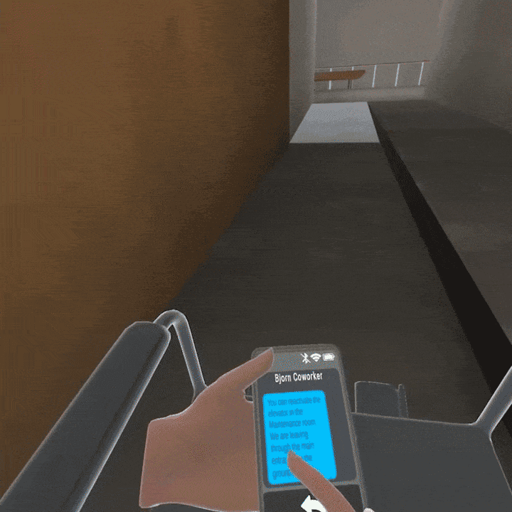 A first-person VR view of a wheelchair approaching a corridor and ramp.